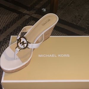 Brand new MK Sandler’s with heel.